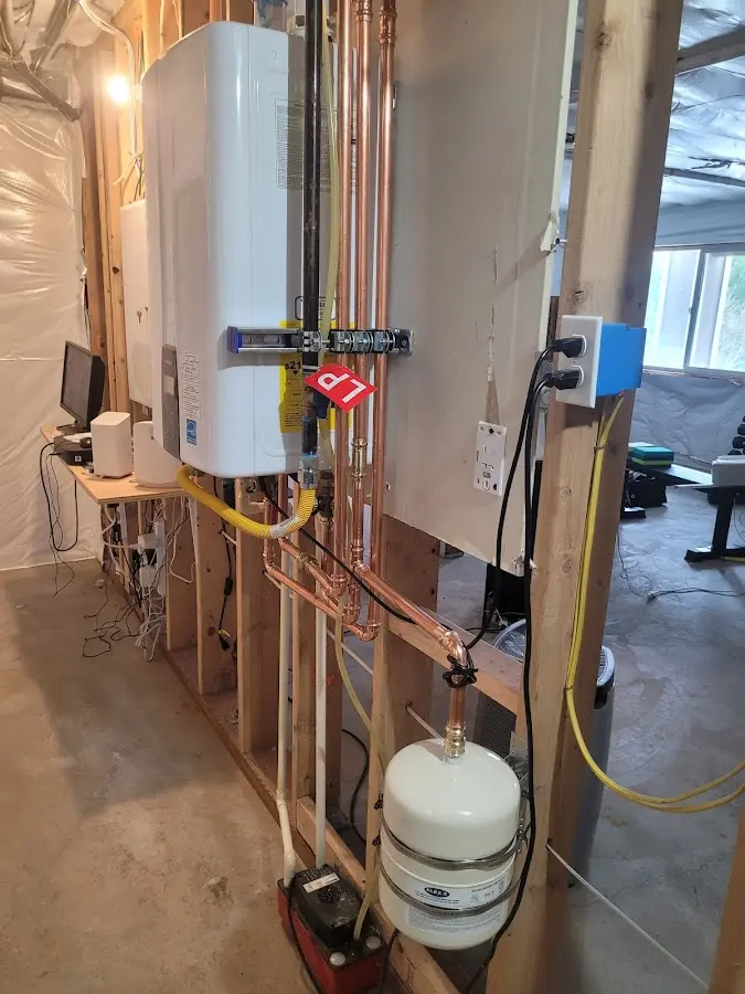 Licensed plumber repairing a kitchen sink in Slinger